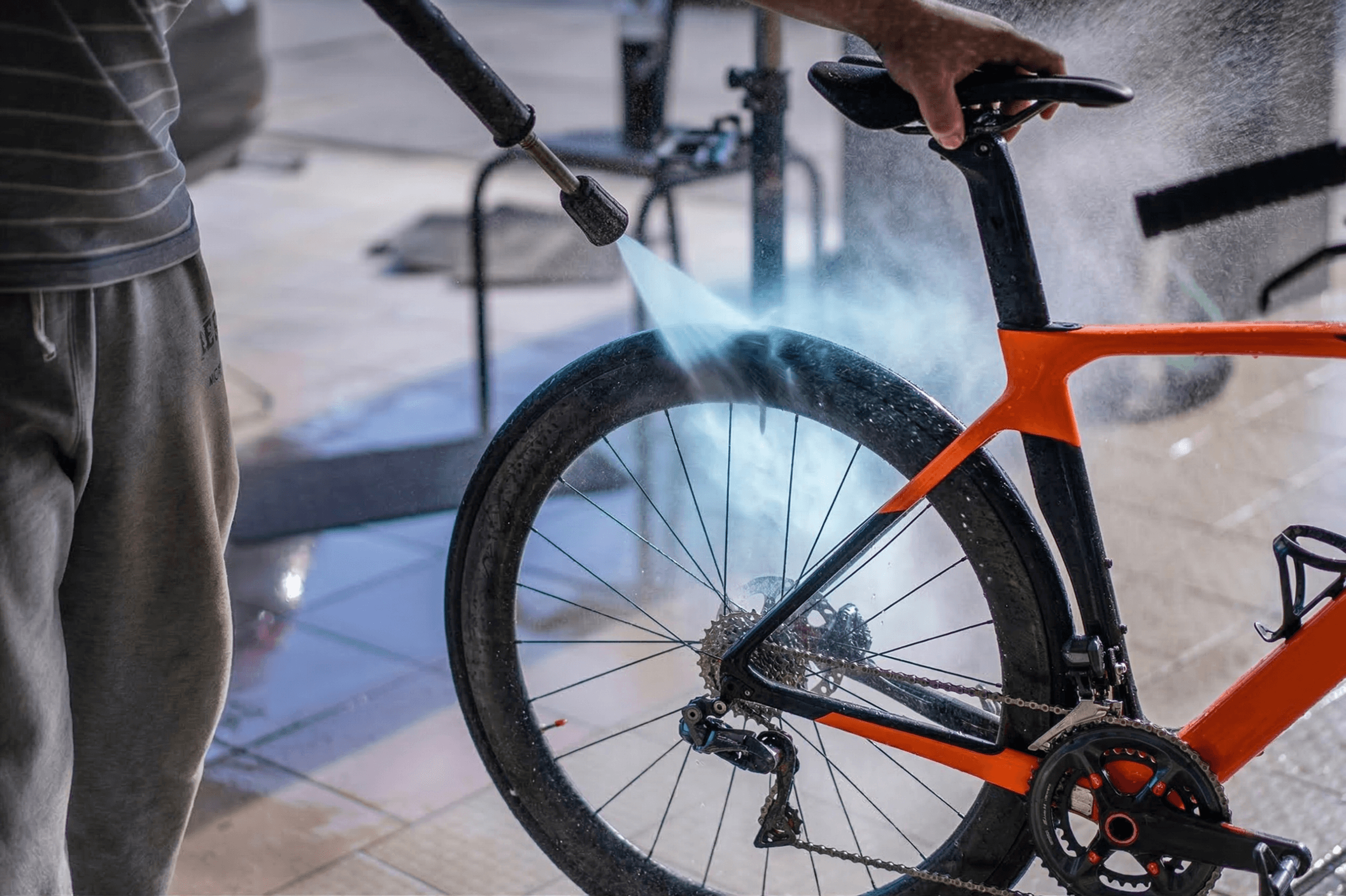 Road bike being cleaned and adjusted in a workshop